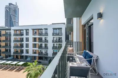 a balcony with a view of a building at Lovely 2BR at Belgravia Square, JVC by Deluxe Holiday Homes in Dubai
