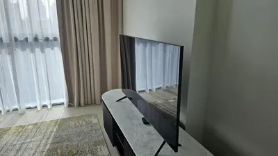 a mirror sitting on a table in front of a window at MH- Act Tower - Downtown 1BHK-REF4606 in Dubai