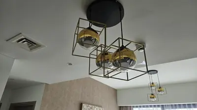 a chandelier hanging from the ceiling in a room at MH- Act Tower - Downtown 1BHK-REF4606 in Dubai