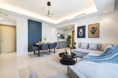 a living room with a couch and a table at SmartStay at Paramount Tower - Sea and Downtown Views - Infinity Pool - Modern Luxury Residences in Dubai