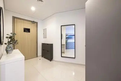 a hallway with a mirror and a dresser at SmartStay at Paramount Tower - Sea and Downtown Views - Infinity Pool - Modern Luxury Residences in Dubai