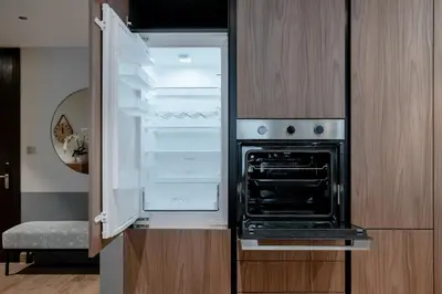 an open refrigerator with its door open in a kitchen at Clever Guest 018 JL Marina gate in Dubai