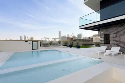a swimming pool on the roof of a building at GuestReady - Marvellous home at Binghatti Heights in Dubai