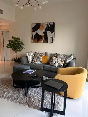 a living room with a couch and two tables at Apartment Dubai Marina, Damac Heights 804 in Dubai