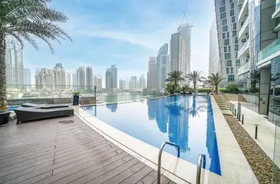 a swimming pool in the middle of a city with tall buildings at Apartment Dubai Marina, Damac Heights 804 in Dubai