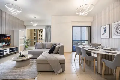 a living room with a couch and a table at Luxury Dubai Eye View Living - Beach access I Marina Walk in Dubai
