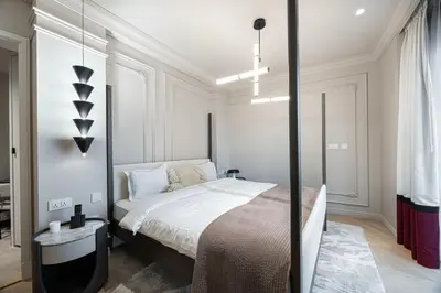 a bedroom with a bed in a white room at The Address Fountain Views - Residence 2 Bedroom with Burj Khalifa view and access to Dubai mall in Dubai