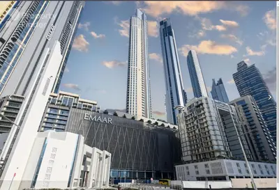 a group of tall buildings in a city at The Address Fountain Views - Residence 2 Bedroom with Burj Khalifa view and access to Dubai mall in Dubai