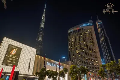 a view of the oriental pearl tower at night at Four Apple EMAAR Fashion Avenue Deluxe Studio in Dubai