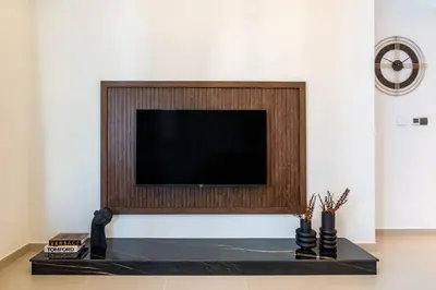 a flat screen tv sitting on top of a table at FIRST CLASS 2BR In the HEART of Downtown Dubai in Dubai