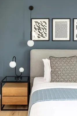 a bedroom with a bed and a nightstand with two lamps at Frank Porter - La Riviera Tower in Dubai