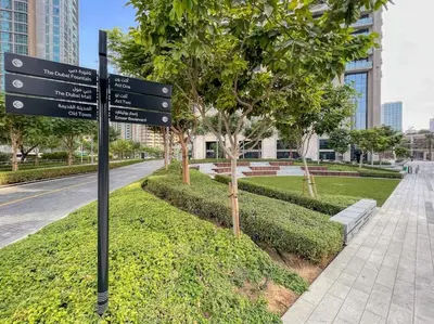 a street sign on the side of a road at Burj Khalifa Views Stylish 2BR Near Dubai Mall and Metro in Dubai