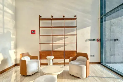 two chairs and a table in a room at Stylish Studio Retreat in Dubai