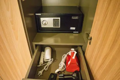 a room with a telephone and a microwave in a hotel room at Stylish Studio Retreat in Dubai