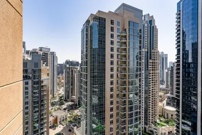 an aerial view of a city with tall buildings at Cozy 1 Bedroom apartment I Downtown Dubai I Near Burj Khalifa in Dubai