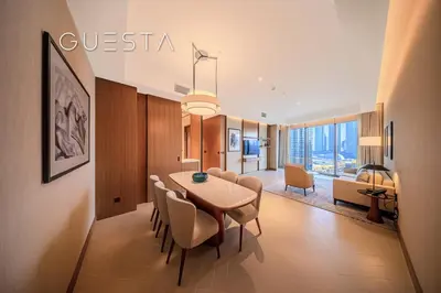 a dining room with a table and chairs at Address Residences Dubai Opera - Burj Khalifa & Fountain View, Downtown Dubai in Dubai
