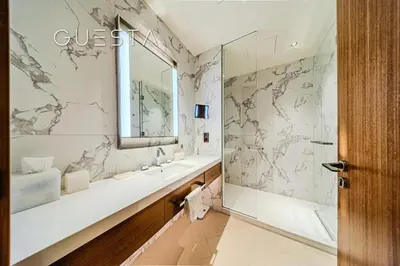 a bathroom with a sink and a mirror at Address Residences Dubai Opera - Burj Khalifa & Fountain View, Downtown Dubai in Dubai
