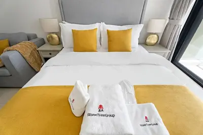 a bedroom with a bed with towels on it at Newly Furnished Studio in JLT in Dubai