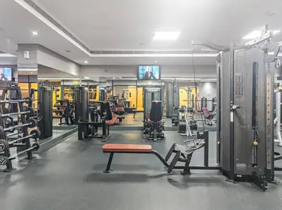 a gym with lots of equipment in a room at Newly Furnished Studio in JLT in Dubai