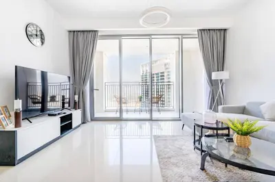 a living room with a couch and a table at Luxury 1BR Retreat l 17 Icon Bay, Dubai Creek in Dubai
