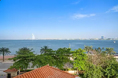 a view of the ocean from a building at Full Sea View 1 BR with Lagoon Pool & Beach Access in Dubai