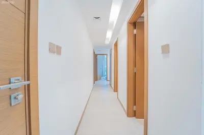 a hallway in a hospital with doors open at Fabulous Missoni Designer Building, 3 bedroom plus maid in Dubai