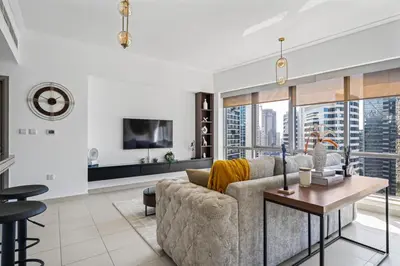 a living room with a couch and a table at Skyline Retreat - South Ridge 2 - Downtown Dubai in Dubai