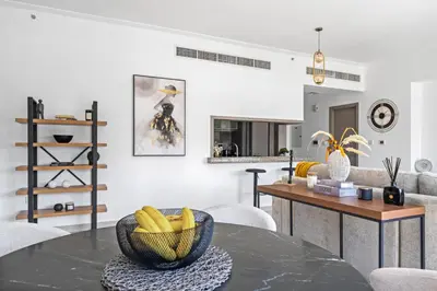 a living room with a table with bananas on it at Skyline Retreat - South Ridge 2 - Downtown Dubai in Dubai