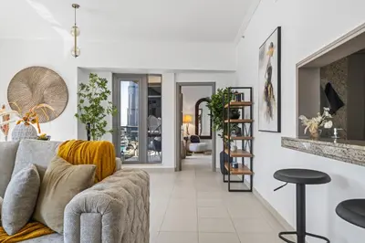 a living room with a couch and a table at Skyline Retreat - South Ridge 2 - Downtown Dubai in Dubai