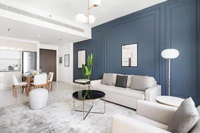 a living room with a couch and a table at Silkhaus Sea & City View 1BDR in Exclusive Neighbourhood in Dubai