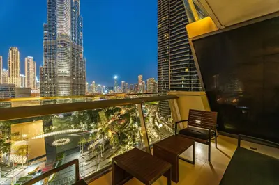 a balcony with two benches and a view of a city at Downtown 3BR Sleeps 9 Balcony, Full Kitchen, Near Metro in Dubai
