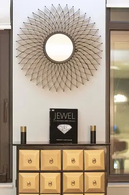 a mirror above a dresser in a room at Apartment KOYO in the heart of JBR Beach - 3BDR in Dubai