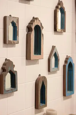 a wall of small wooden windows on a wall at Apartment KOYO in the heart of JBR Beach - 3BDR in Dubai