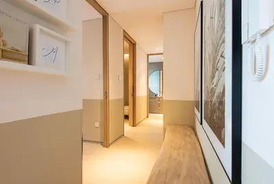a hallway with a wooden bench in a house at Address JBR 2 Bedroom With Beach Access by Millennium Vacation Homes in Dubai