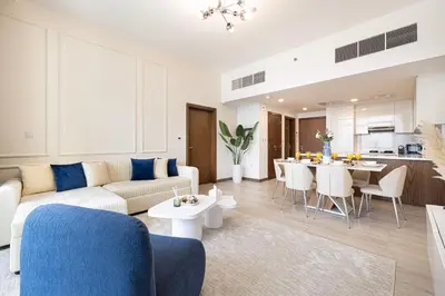 a living room with a couch and a table at SmartStay at Zaya Hameni - Modern Luxury Apartments - Unique in JVC in Dubai