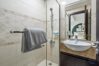 a bathroom with a sink and a mirror at GuestReady - A Dream Getaway at Business Bay in Dubai
