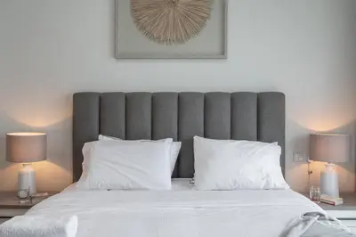 a bedroom with a large bed with white pillows at DAYF-SOL Luxury Living in Business Bay in Dubai