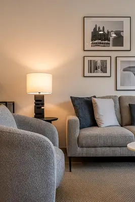 a living room with two chairs and a lamp at Modern 1BDR Apartment I Madinat Jumeirah Living I Asayel 3 in Dubai