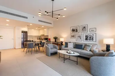 a living room with a couch and a table at Modern 1BDR Apartment I Madinat Jumeirah Living I Asayel 3 in Dubai