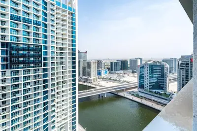 a view of a city with a river and buildings at Studio Apartment in DAMAC Maison Prive Business Bay - High Floor in Dubai