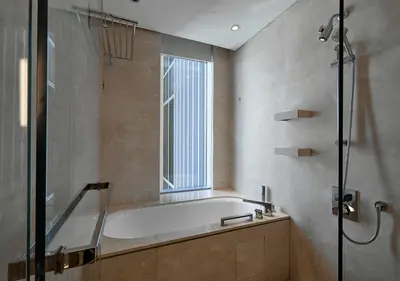 a bathroom with a bath tub and a window at Dubai Marina Residences, Studio with Balcony Connected to Marina Mall in Dubai