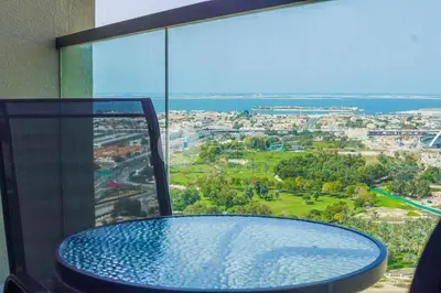 a glass table with a view of a city at Elegant Studio at Aykon City Tower - C in Dubai