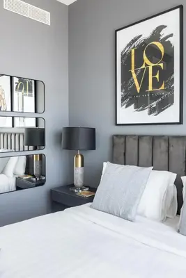 a bedroom with a bed with white sheets and a lamp at Marina Skyline View & Dubai Harbour Beachfront in Dubai
