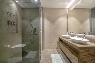 a bathroom with two sinks and a shower at Livin' Holidays - Luxury apartment in Dubai Marina in Dubai