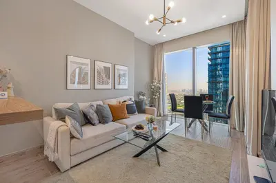 a living room with a couch and a table at Livin' Holidays - Luxury apartment in Dubai Marina in Dubai
