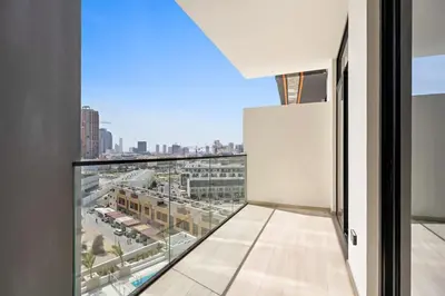 a balcony with a view of a city at Stunning modern 3BR apartment in JVC in Dubai