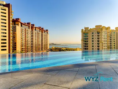 a swimming pool in the middle of some buildings at Palm Tower Luxury Studio W Stunning Sea View in Dubai