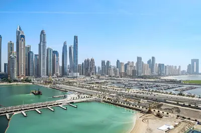 a view of a city with a bridge and a harbor at Silkhaus Sea and City View 1BDR in Marina Vista in Dubai