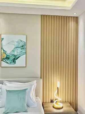 a bedroom with a bed with a wooden wall at Your Scenic Dream Vacation in Dubai