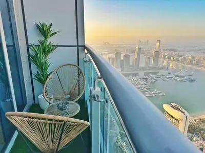 a balcony with chairs and a view of the city at Your Scenic Dream Vacation in Dubai